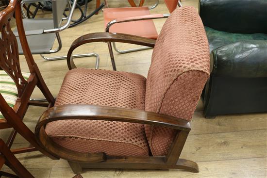 A pair of Art Deco simulated rosewood reclining armchairs